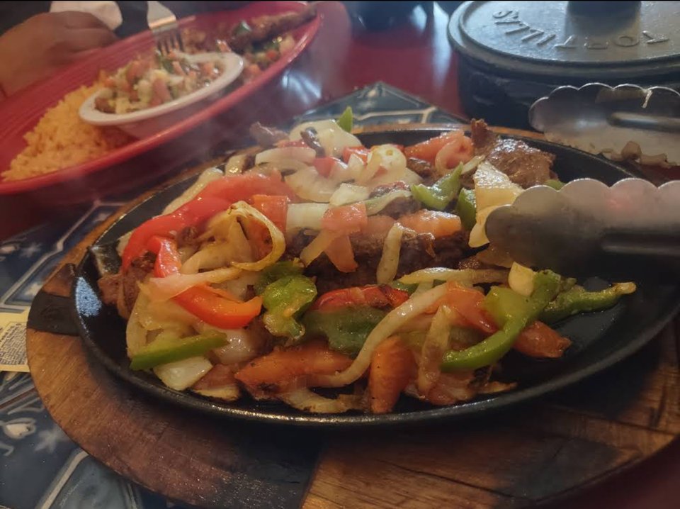 A lively meal with tacos, fajitas, and cocktails.